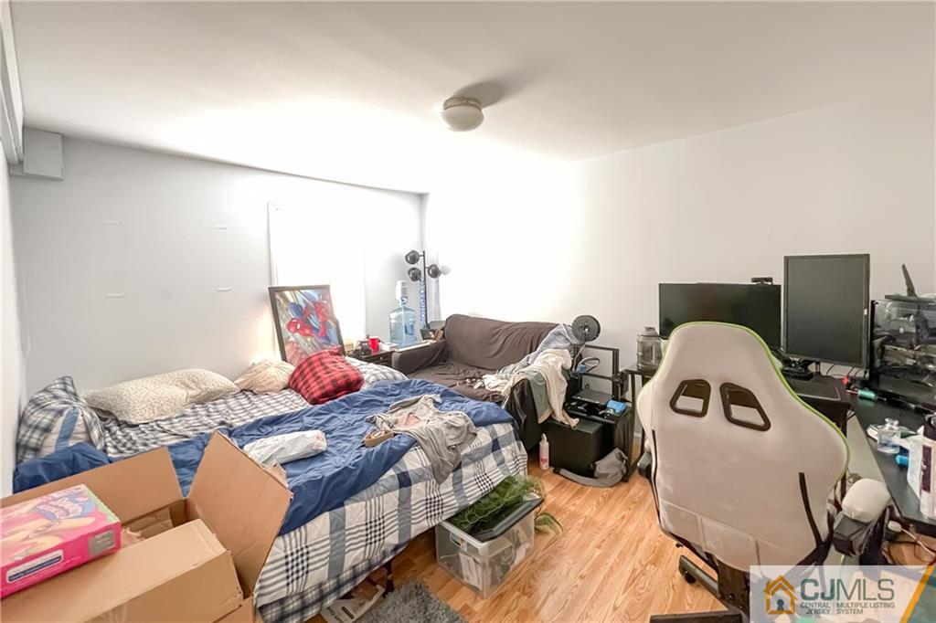 84 Guilden Street New Brunswick, NJ 08901 - Photo 15 of 27 a living room with furniture and a window