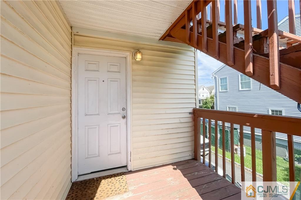 84 Guilden Street New Brunswick, NJ 08901 - Photo 27 of 27 a balcony view with a wooden floor