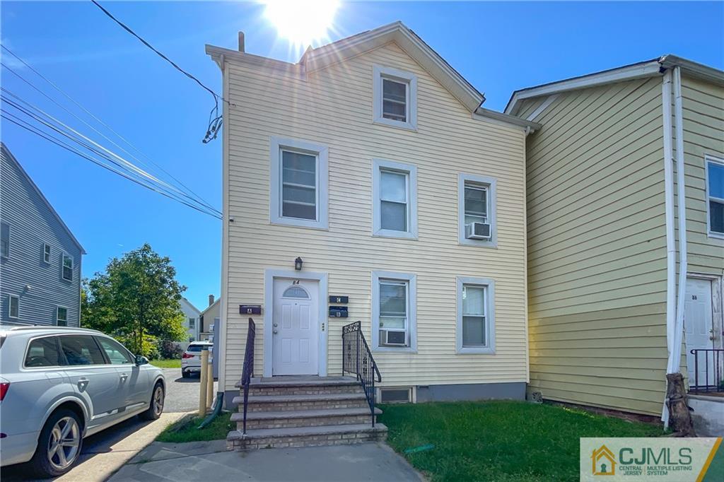 84 Guilden Street New Brunswick, NJ 08901 - Photo 4 of 27 a view of a house with a car park side of a road