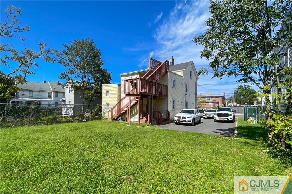 84 Guilden Street New Brunswick, NJ 08901 - Photo 5 of 27 a view of a house with a cars park