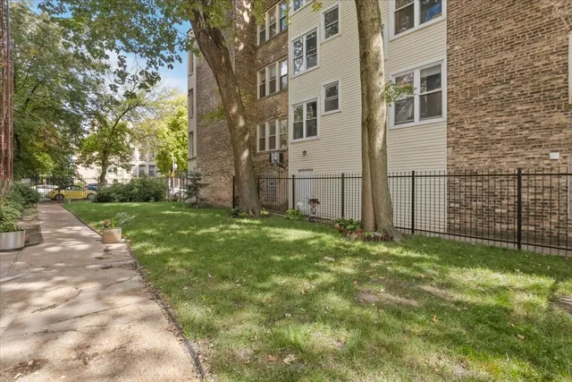 a view of a backyard of the house