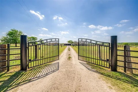 a view of a wrought iron fences in front of house