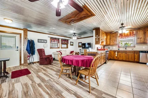 a living room with lots of furniture and a chandelier