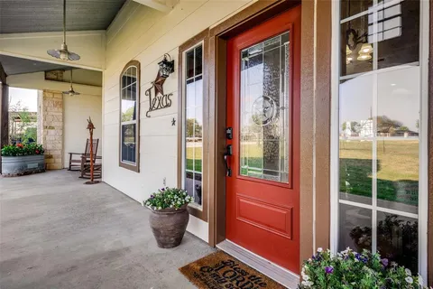 a view of a entryway door front of a house