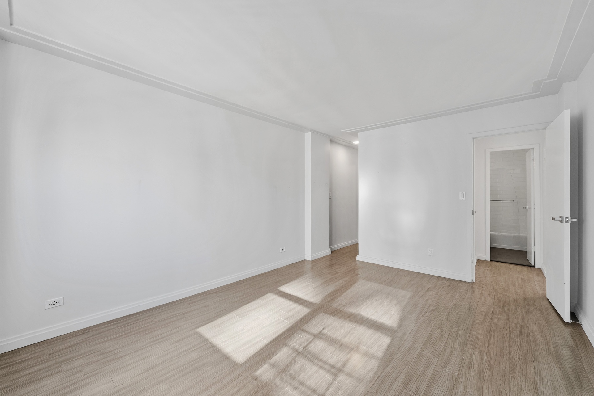 340 East 80th Street, Unit 17D Manhattan, NY 10075 - Photo 10 of 18 a view of an empty room and wooden floor