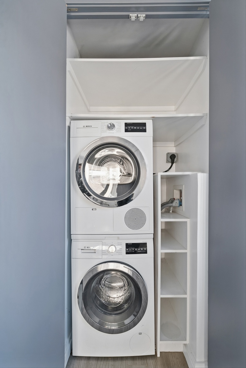 340 East 80th Street, Unit 17D Manhattan, NY 10075 - Photo 17 of 18 a utility room with washing machine