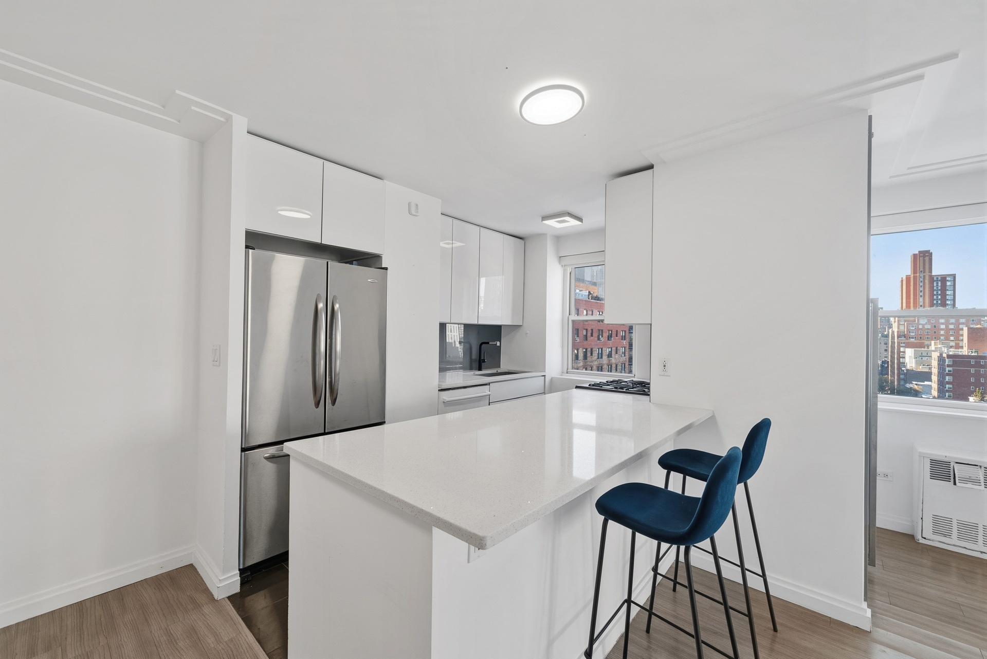 340 East 80th Street, Unit 17D Manhattan, NY 10075 - Photo 6 of 18 a large kitchen with a table and chairs