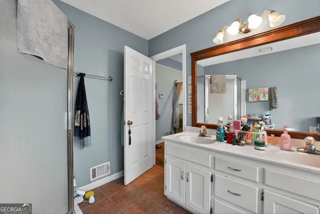 a bathroom with sink and mirror