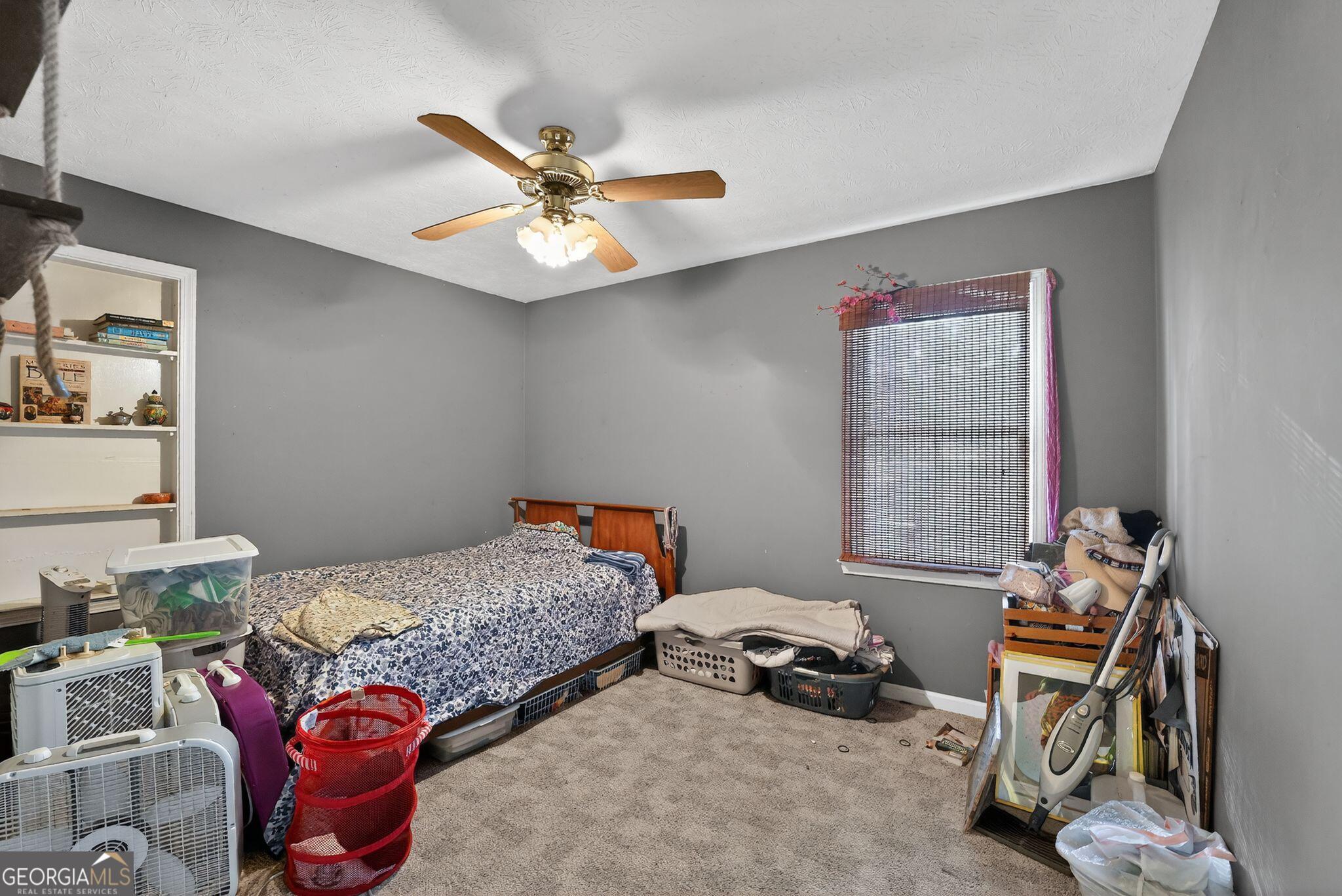 401 The Farm Road McDonough, GA 30252 - Photo 13 of 29 a bedroom with a bed and a window