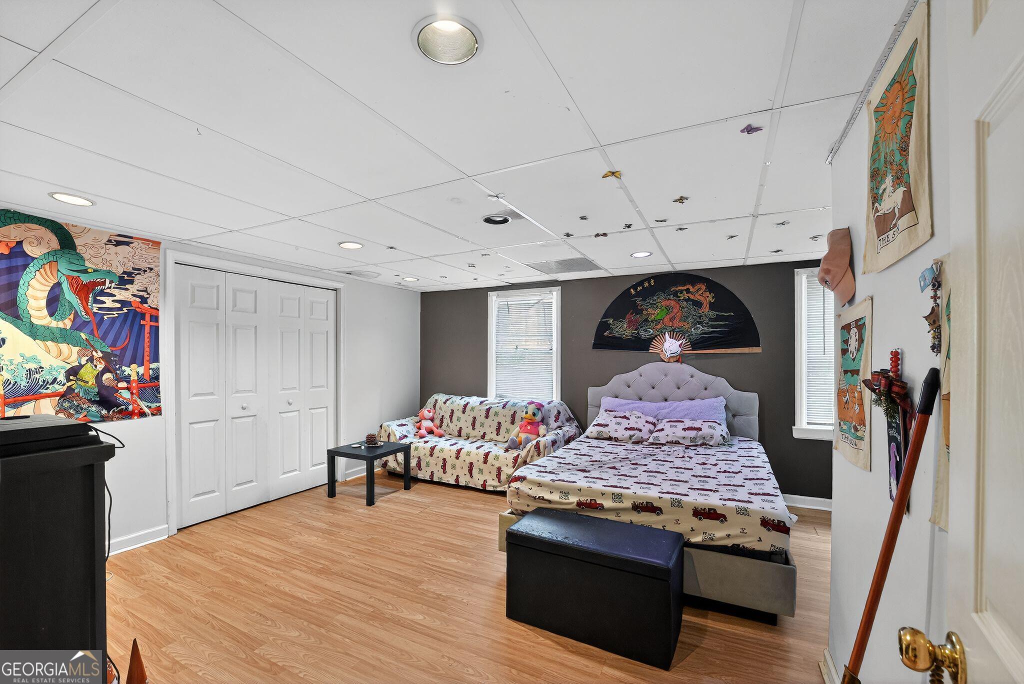 401 The Farm Road McDonough, GA 30252 - Photo 18 of 29 a living room with furniture and a flat screen tv