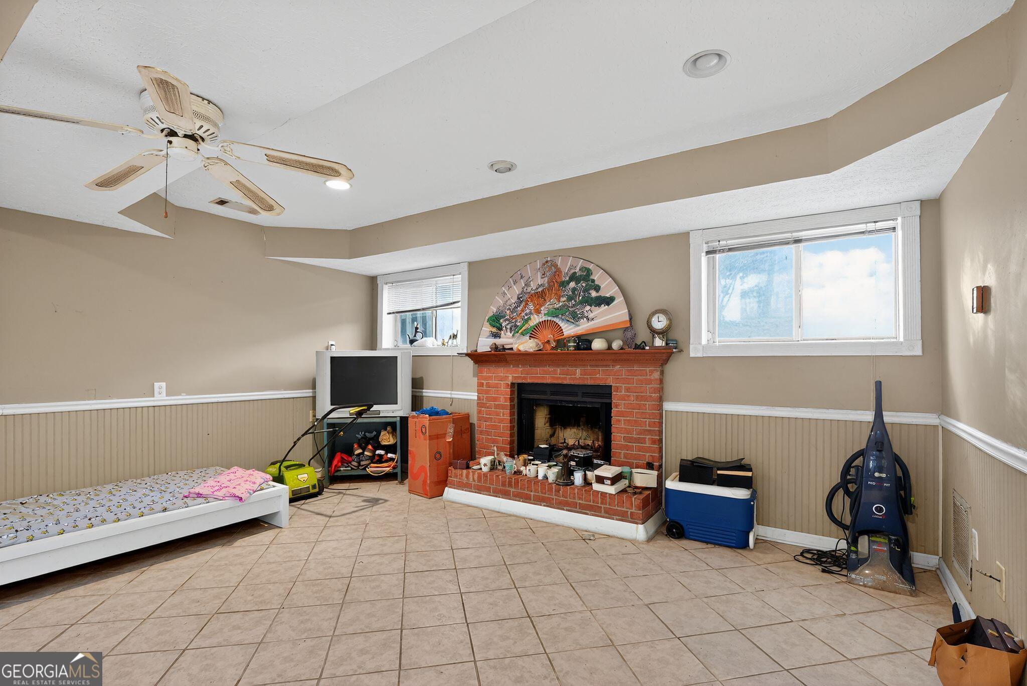 401 The Farm Road McDonough, GA 30252 - Photo 19 of 29 a living room with furniture and a flat screen tv