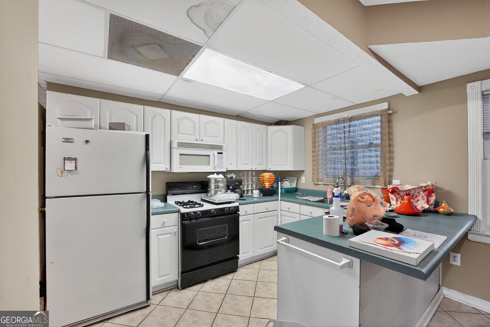 401 The Farm Road McDonough, GA 30252 - Photo 20 of 29 a kitchen with stainless steel appliances a refrigerator sink and cabinets
