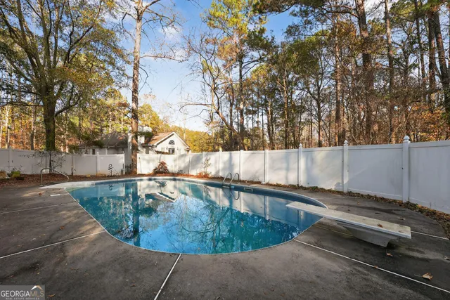 a view of a swimming pool with a patio