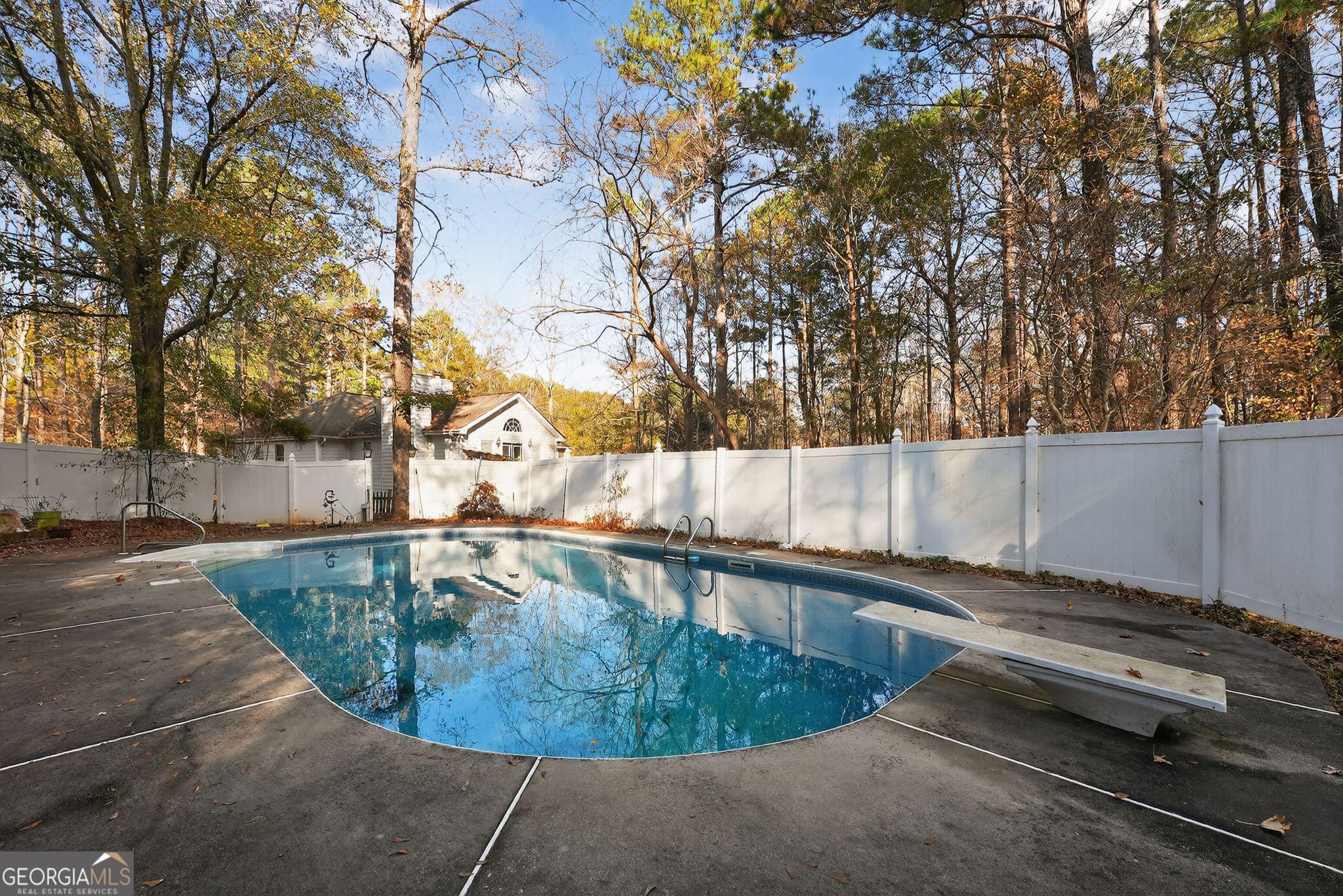 401 The Farm Road McDonough, GA 30252 - Photo 2 of 29 a view of a swimming pool with a patio