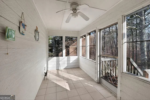 a view of entryway and hall with a rug