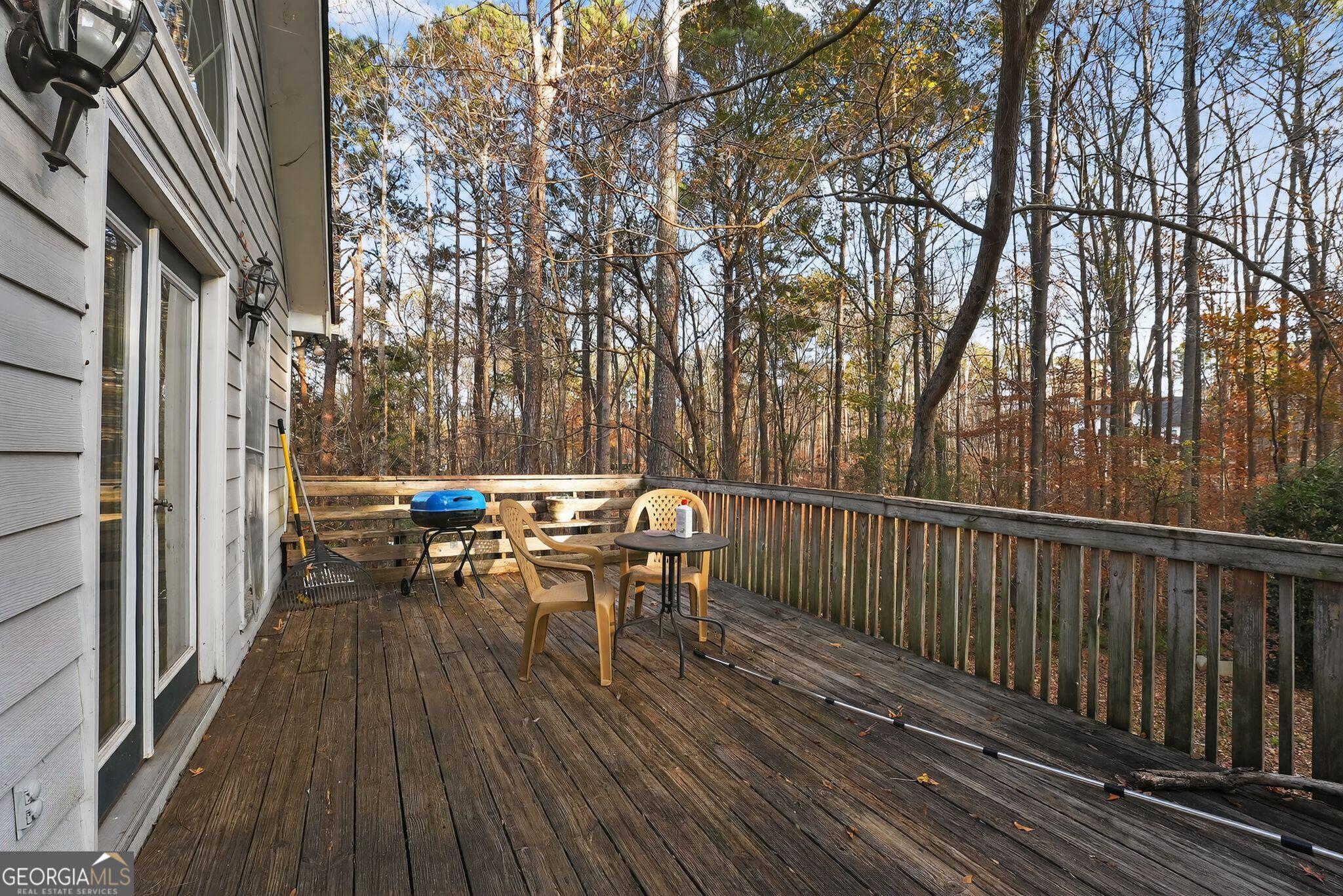 401 The Farm Road McDonough, GA 30252 - Photo 25 of 29 a view of balcony with wooden floor and outdoor seating