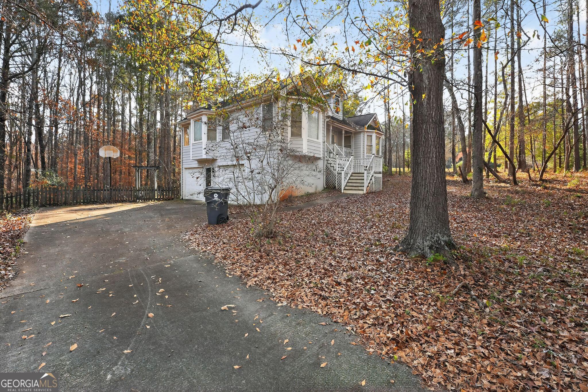 401 The Farm Road McDonough, GA 30252 - Photo 27 of 29 a backyard of a house with barbeque oven and outdoor seating