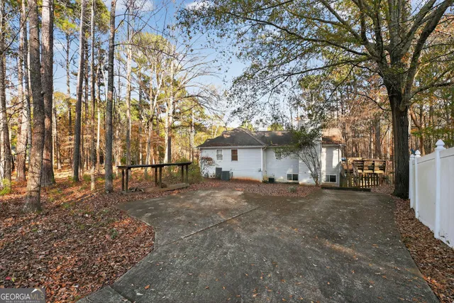 a view of a house with a yard covered in snow