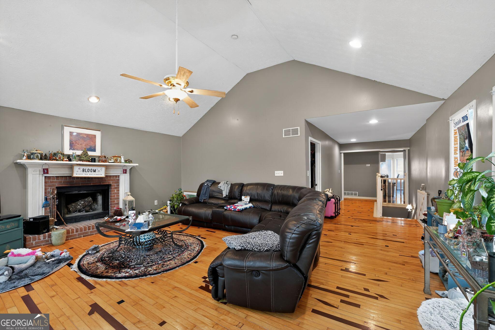 401 The Farm Road McDonough, GA 30252 - Photo 4 of 29 a living room with furniture and a fireplace