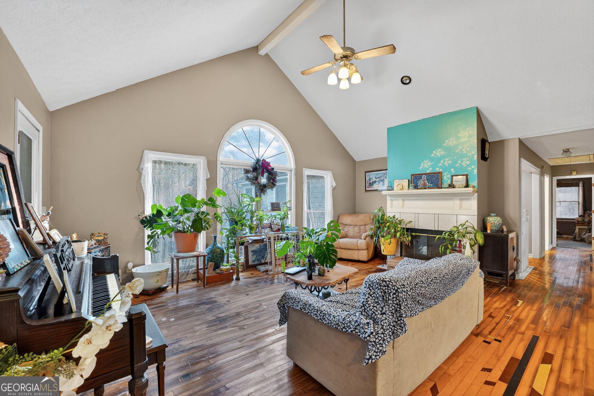 401 The Farm Road McDonough, GA 30252 - Photo 5 of 29 a living room with furniture fireplace and a flat screen tv