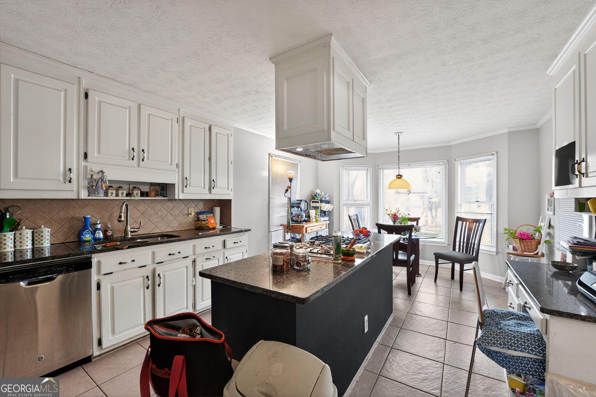 401 The Farm Road McDonough, GA 30252 - Photo 6 of 29 a kitchen with a sink stove and cabinets