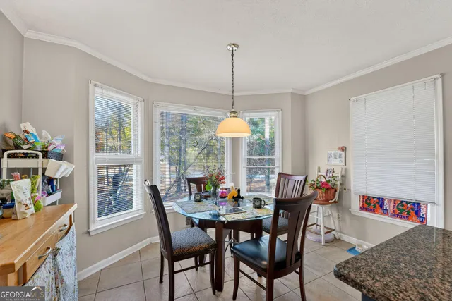 a dining room with furniture and window