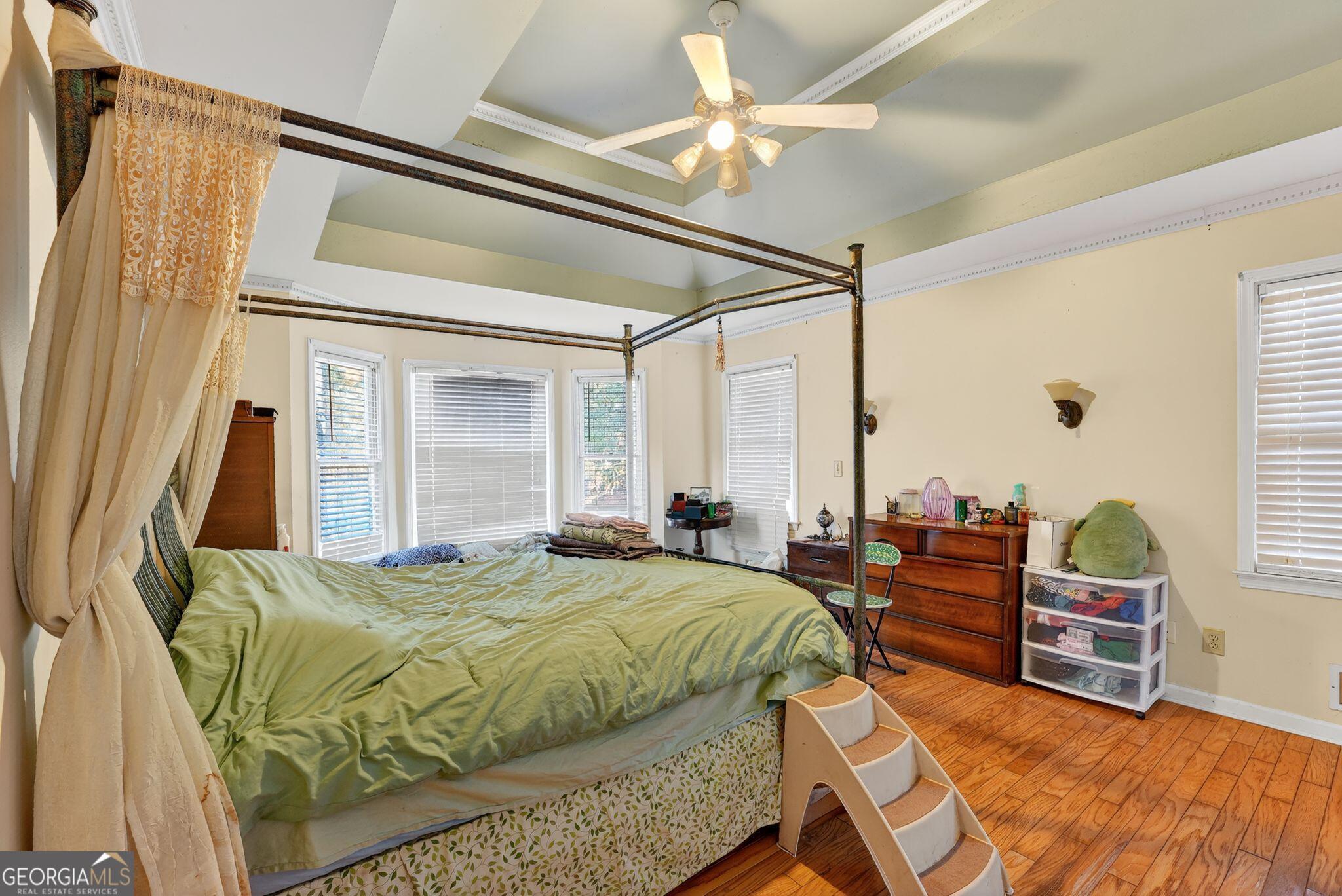 401 The Farm Road McDonough, GA 30252 - Photo 10 of 29 a bedroom with a bed window and couch