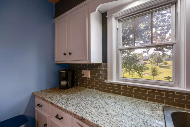 a kitchen with a stove and a microwave