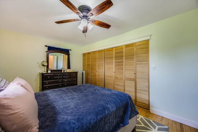 a view of a workspace with furniture and a flat screen tv