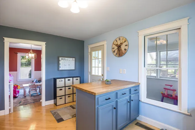 a bedroom with furniture and a window