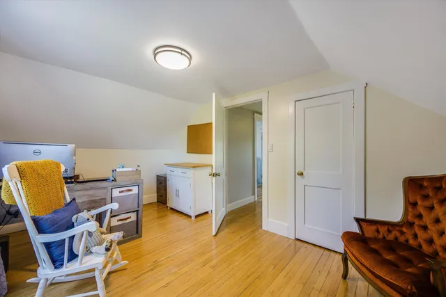 a bedroom with furniture and a window