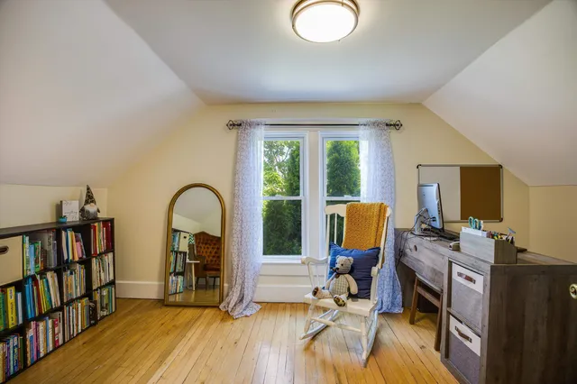 a view of a room with wooden furniture