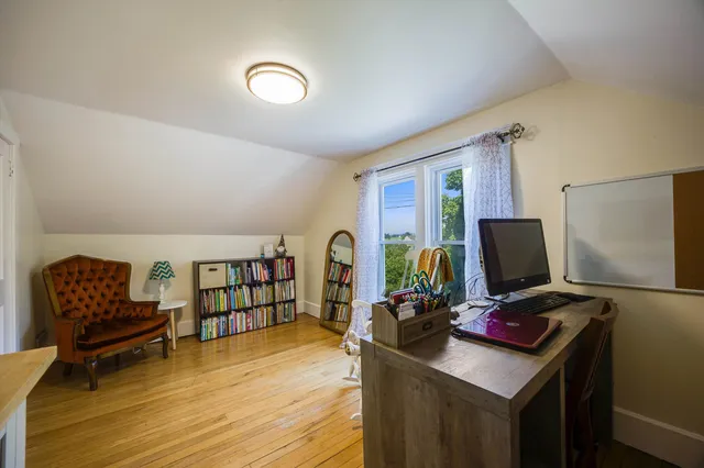 a view of a garage with a bike and car