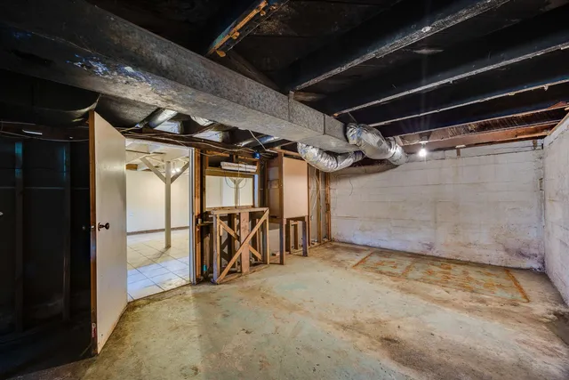 an aerial view of a house with swimming pool and garden space