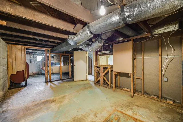 an aerial view of residential house with an outdoor space and seating area