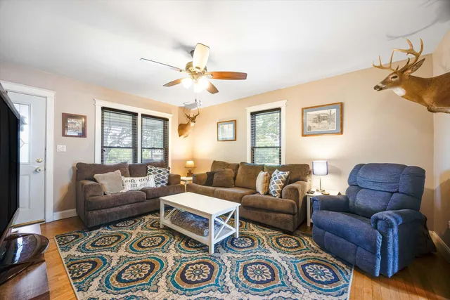 a living room with furniture and a window