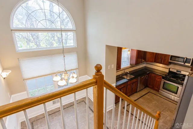 a view of an chairs and table in a balcony