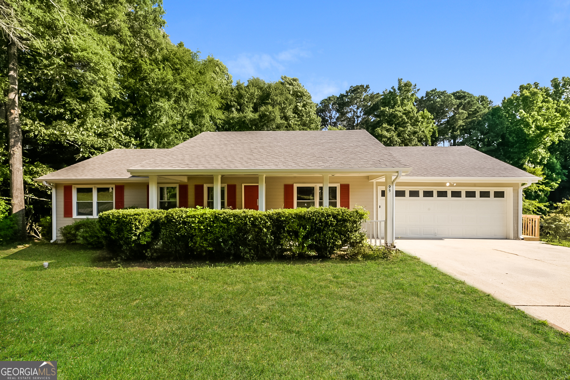 95 High Ridge Road Covington, GA 30014 - Photo 1 of 16 a front view of a house with a garden