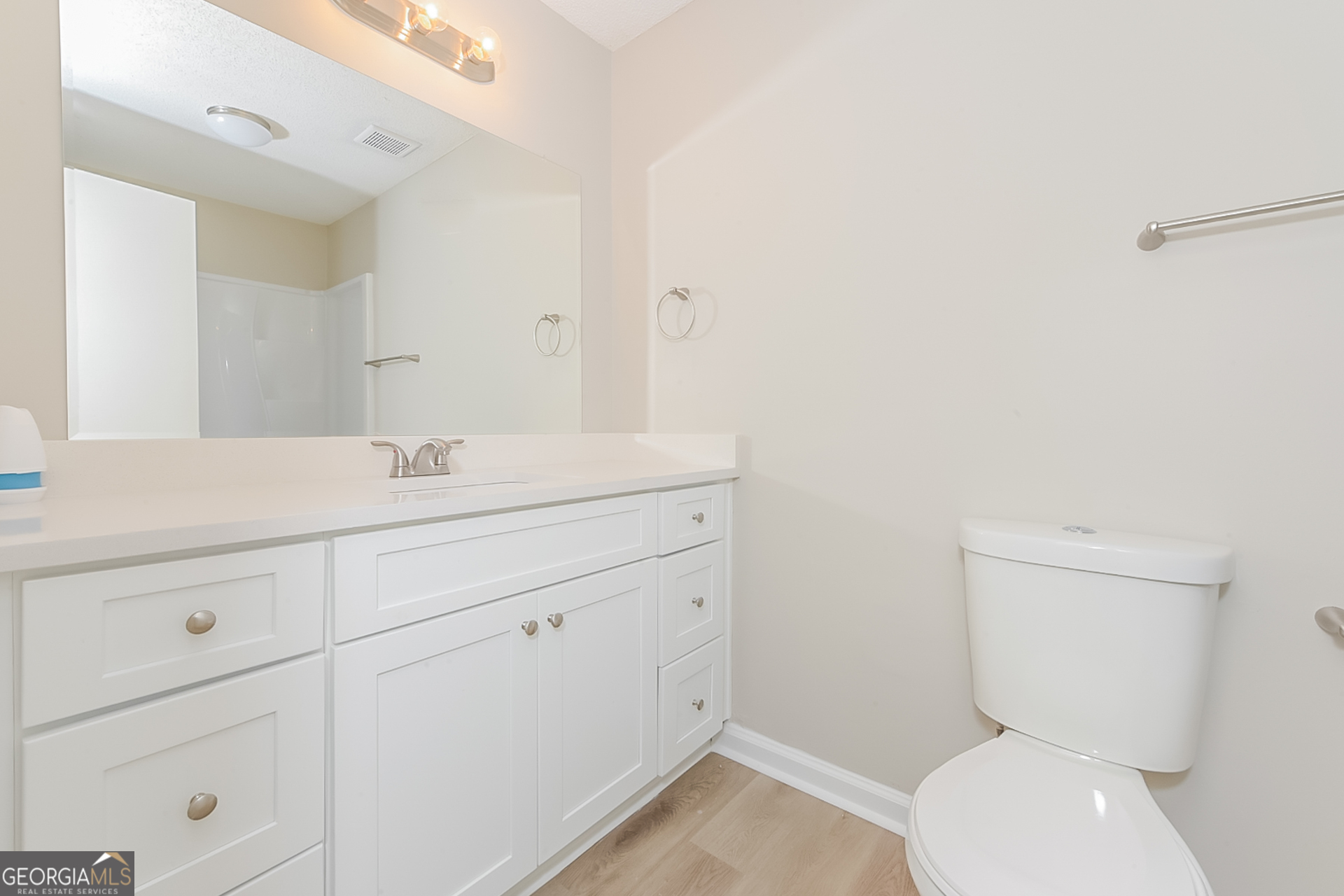 95 High Ridge Road Covington, GA 30014 - Photo 14 of 16 a bathroom with a toilet sink and mirror