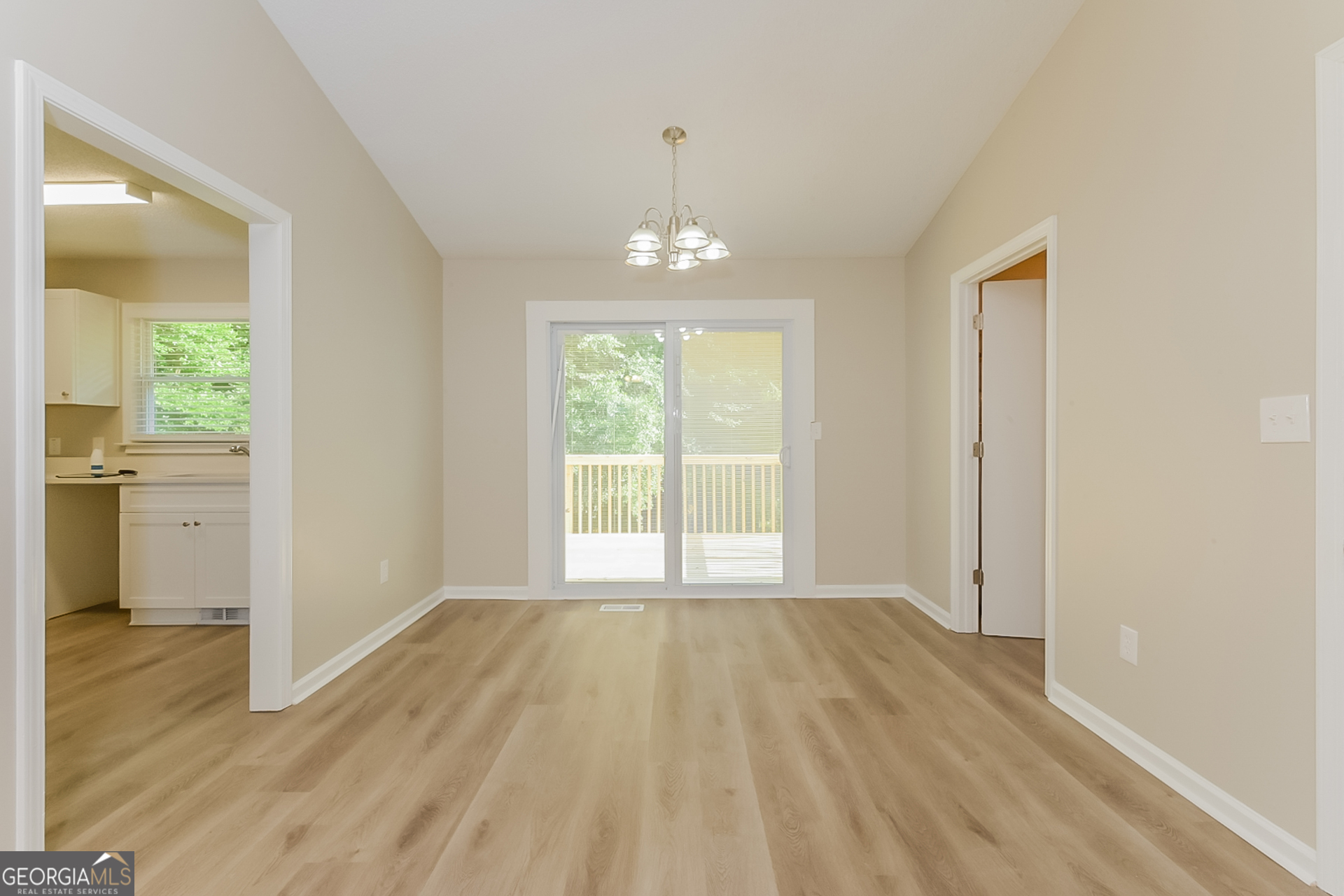 95 High Ridge Road Covington, GA 30014 - Photo 4 of 16 wooden floor in an empty room with a window