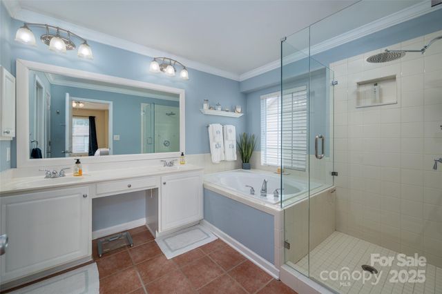 a spacious bathroom with a sink shower and a mirror
