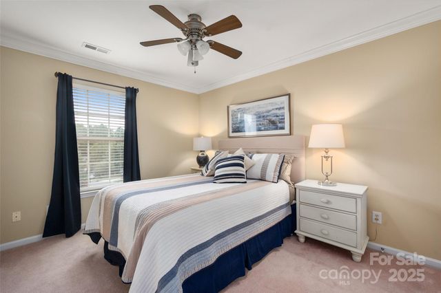 a bedroom with bed and a window