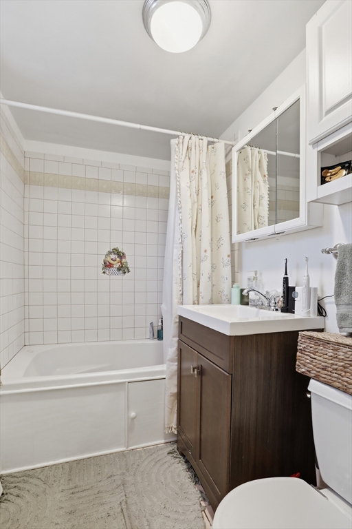 1 Colonial Drive, Unit B1 Andover, MA 01810 - Photo 10 of 14 a bathroom with a sink a toilet and shower