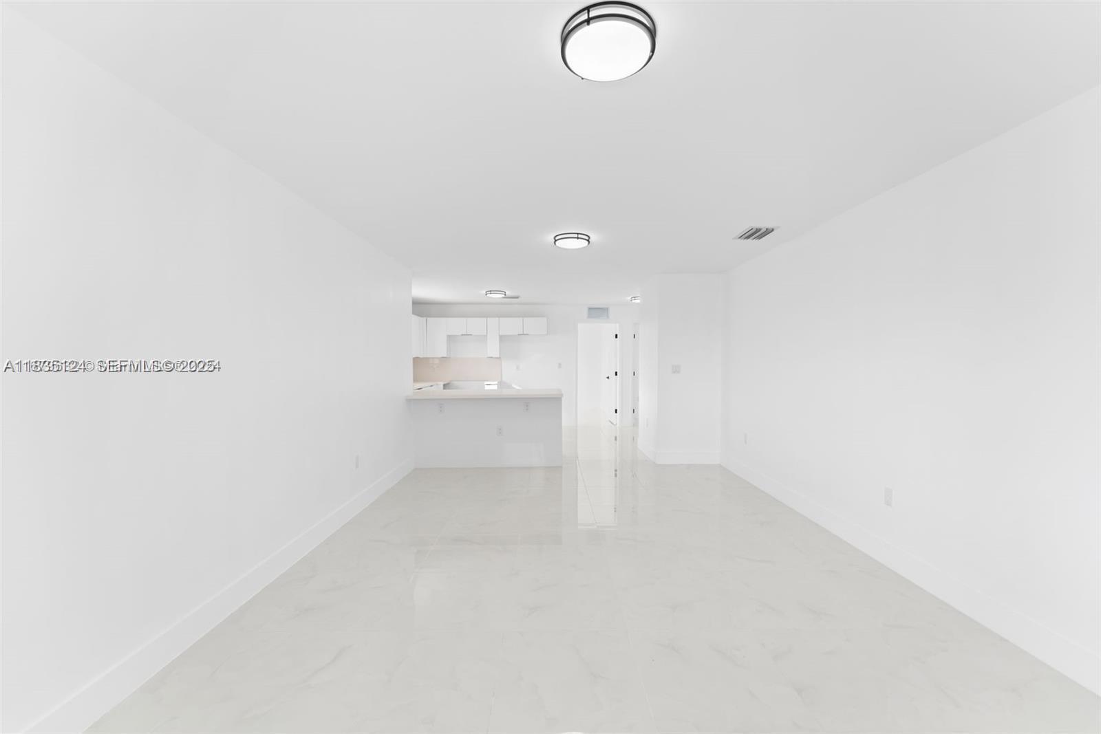 11997 Southwest 218th Street, Unit 1 Miami, FL 33170 - Photo 2 of 12 a view of empty room