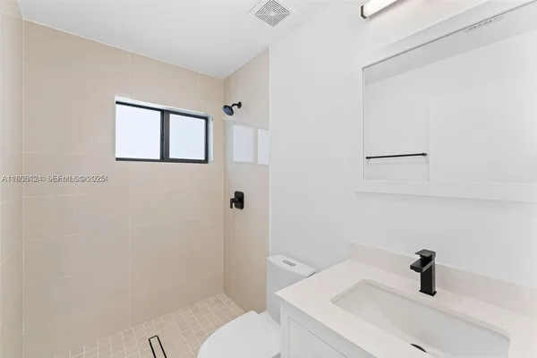 a bathroom with a sink and a toilet