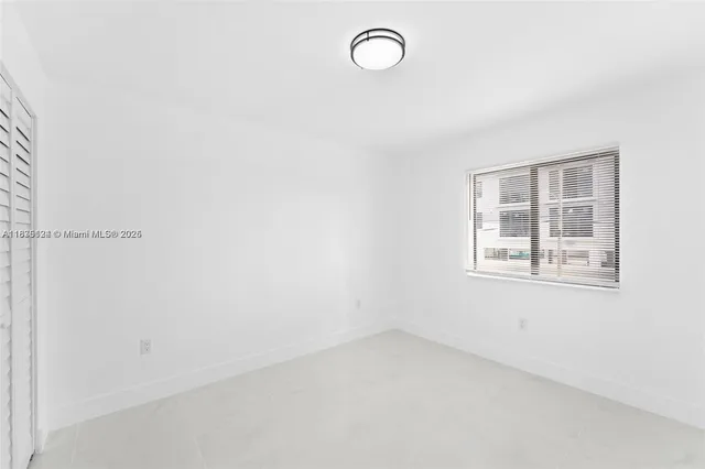 a large kitchen with cabinets and stainless steel appliances