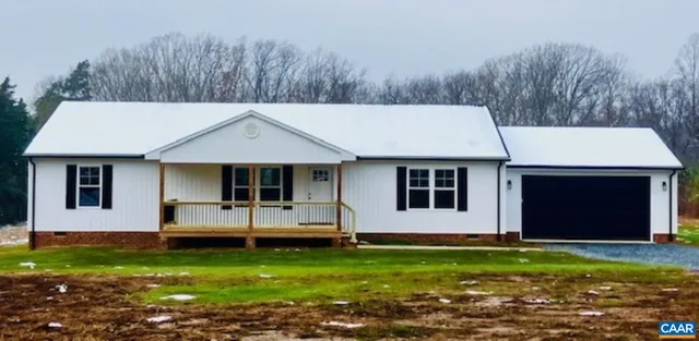 a kitchen with stainless steel appliances granite countertop a refrigerator a stove a sink and a microwave