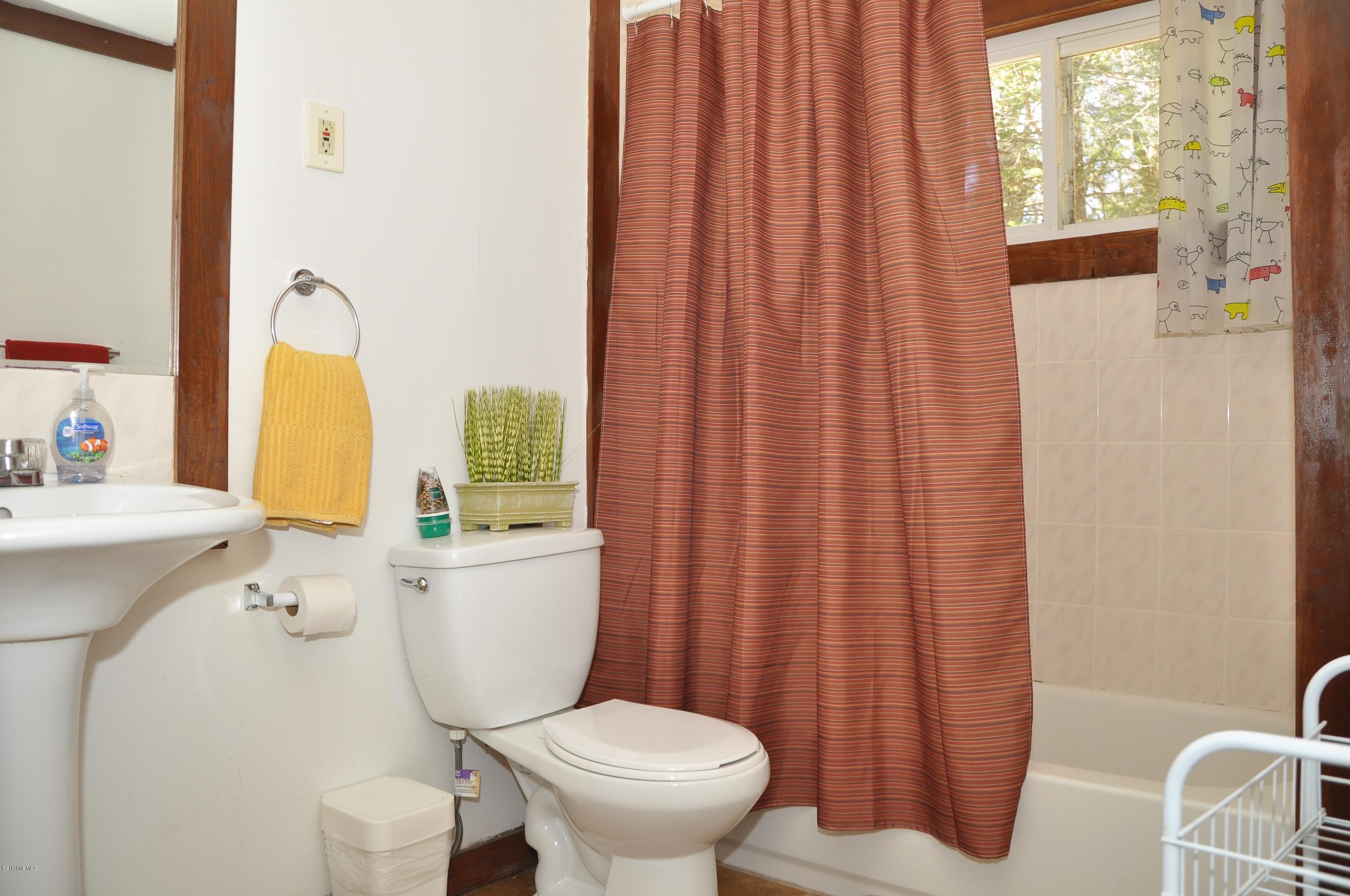 462 East Otis Road Tolland, MA 01034 - Photo 17 of 29 a white toilet sitting next to a bathroom sink