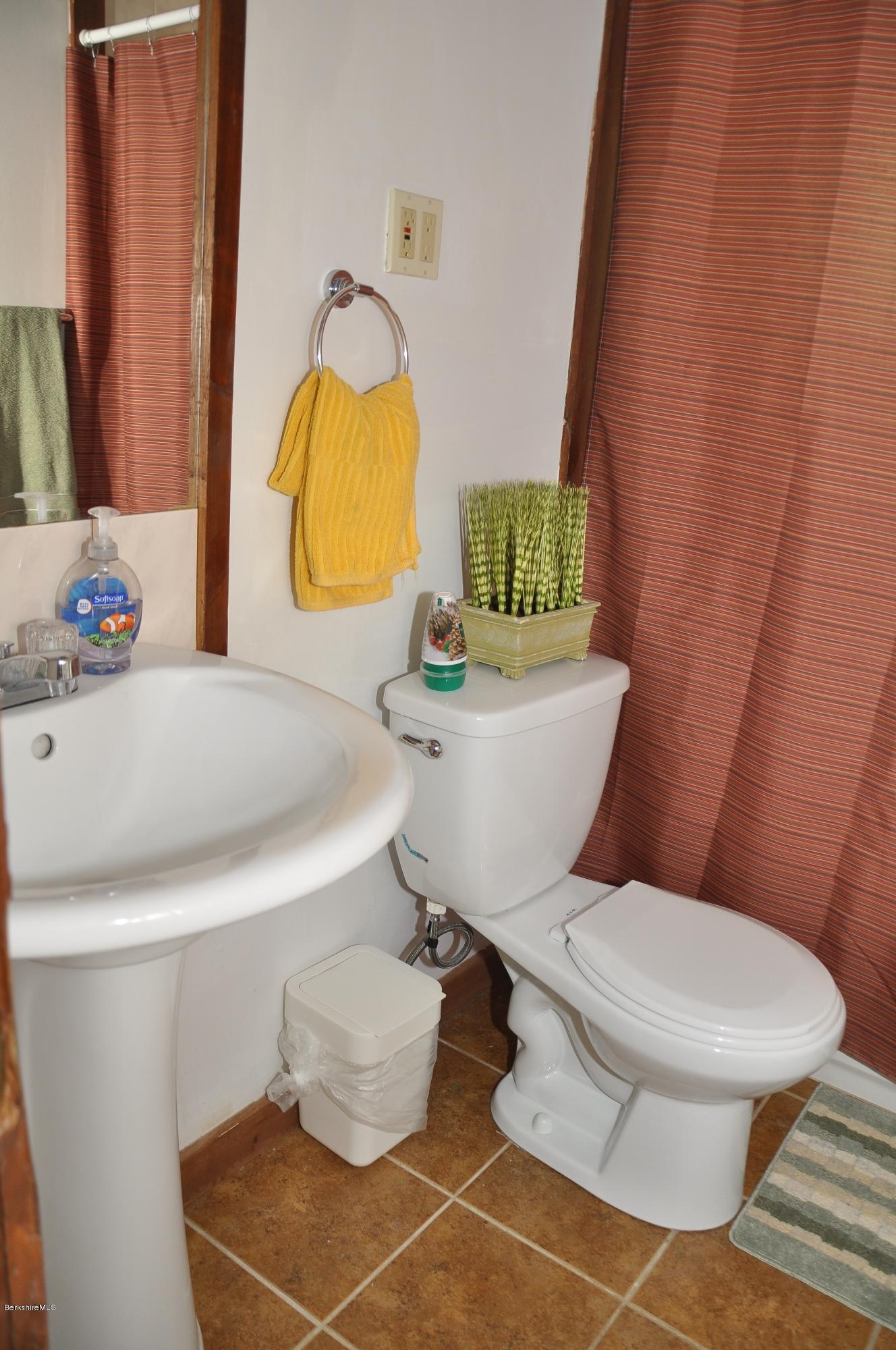 462 East Otis Road Tolland, MA 01034 - Photo 21 of 29 a bathroom with a sink toilet and mirror