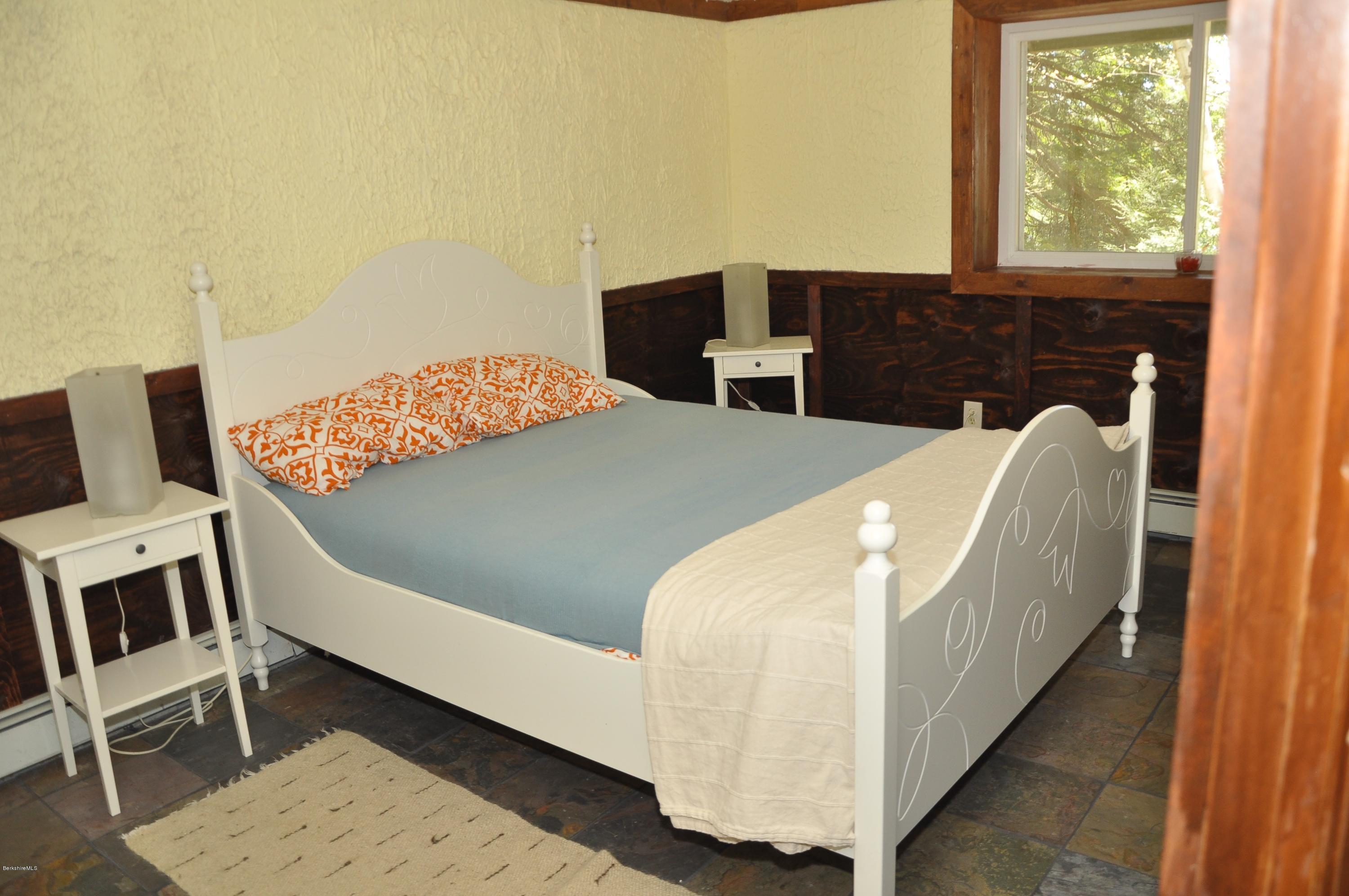 462 East Otis Road Tolland, MA 01034 - Photo 24 of 29 a bedroom with a bed and wooden floor